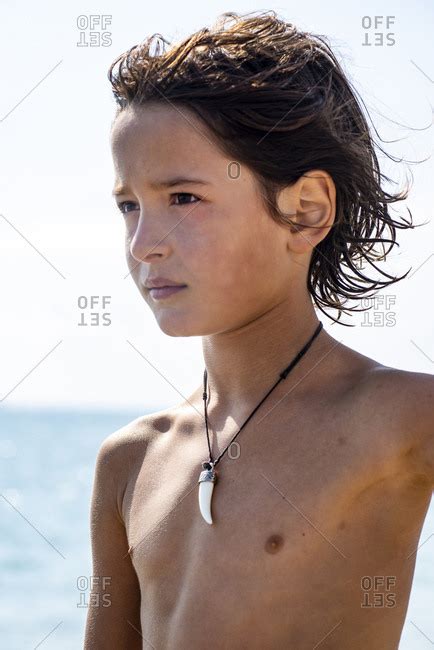 Portrait Of Shirtless Boy On A Summer Day At The Beach Stock Images