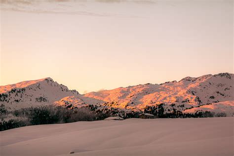 Photo Of Snow Capped Mountains During Dawn · Free Stock Photo