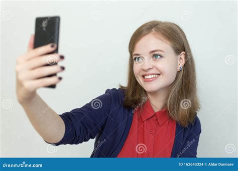 Smiling Young Caucasian Girl Woman Taking Selfie Or Making A Video Call