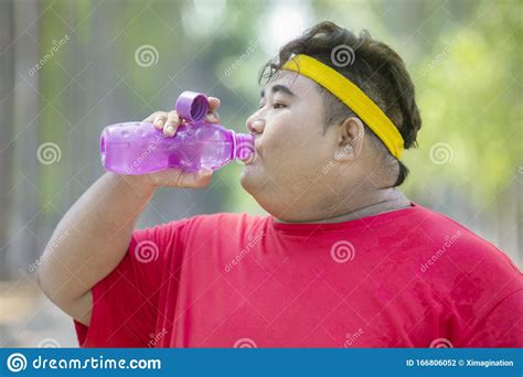 Portrait Of Fat Asian Man Drinking Bottled Water Stock Photo Image Of