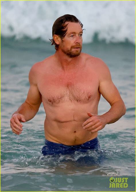 Simon Baker Goes For Dip In The Ocean While At The Beach With Son Harry