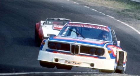 Two Bmws Racing On A Race Track