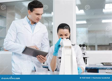 Attentive Female Scientist Examining Dna Chain Stock Photo Image Of