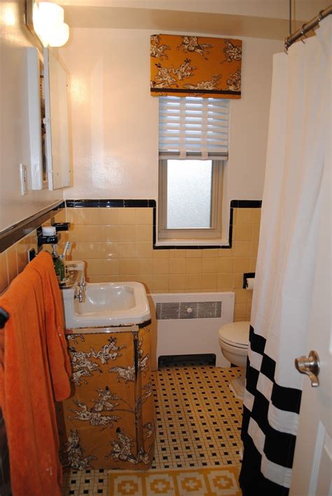 Vintage yellow bathroom tile 2019. Skirt on a sink in a pretty yellow and black tiled ...
