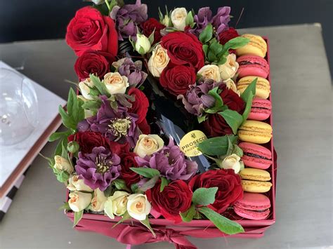 I buy these for my son, daughter and hubby for birthdays and christmas and they. Gift Box with Fresh Flowers Macaroons and Champagne in ...