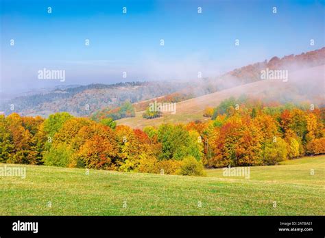 Foggy Mountain Scenery In Autumn Clouds Rising Above The Rolling Hills