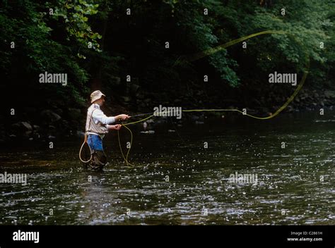 Fly Fisherman Casting His Line In A Stream In Fairmount Park Stock