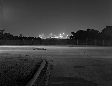 The Ominous Glow Of Prison Lights Photographed On The Outskirts Of
