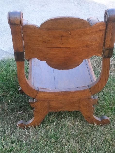 Antique ornate carved solid oak mythical face chair. I Have An Antique Hand Carved Wood Chair With A Face On It ...