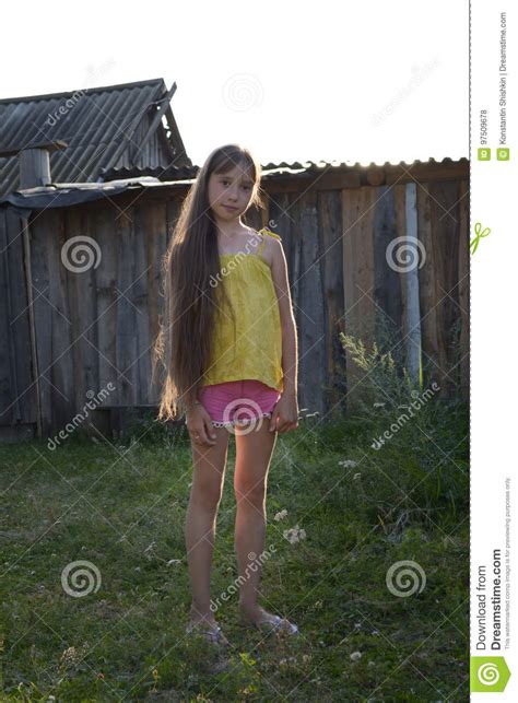Teen Girl With Long Hair In Countryside Yard Russian