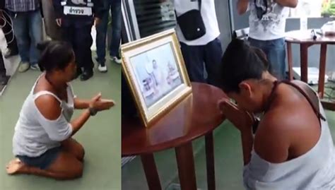 a thai woman accused of insulting the country s late king was forced to kneel before his portr
