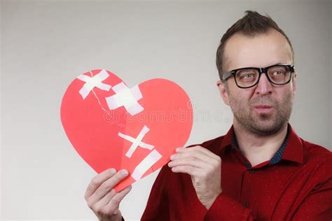 124 Divorce Concept Man Holding Broken Heart Plaster Stock Photos