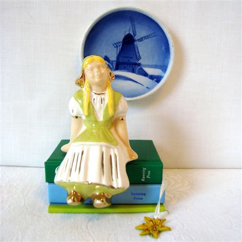 vintage dutch girl sitting ceramic figurine