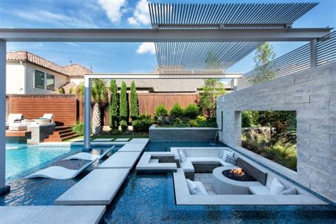 An Outdoor Living Area With Couches And Fire Pit