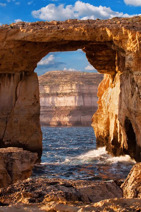 Azure Window Natural Stone Arch By Dwejra Cliffs At Western Gozo Island