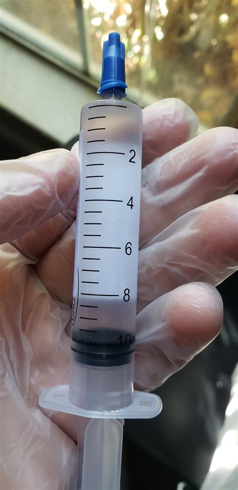 Is this a legit spore syringe? Or was I scammed? Spores are not visible after shaking syringe ...
