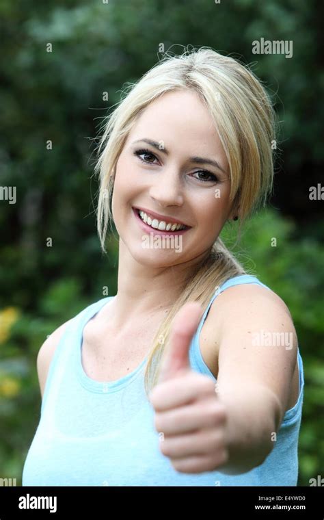 Smiling Beautiful Woman Giving A Thumbs Up Stock Photo Alamy