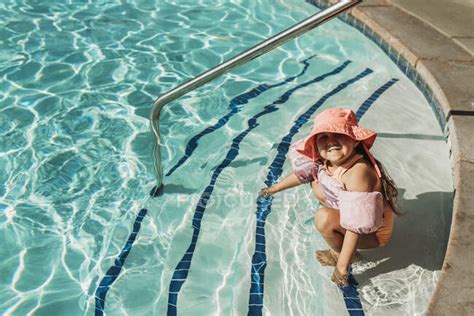 Young Preschool Age Girl Swimming In Pool On Vacation In Palm Springs