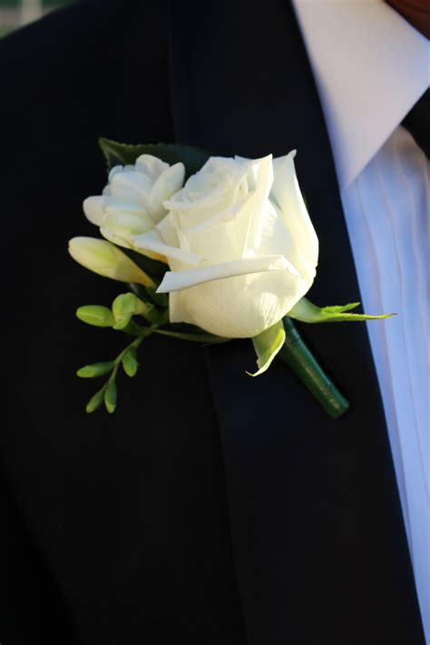 White Freesia And White Rose Makes A Classic Buttonhole For Any Groom