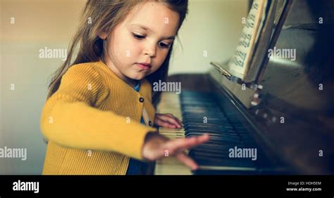 Adorable Cute Girl Playing Piano Concept Stock Photo Alamy