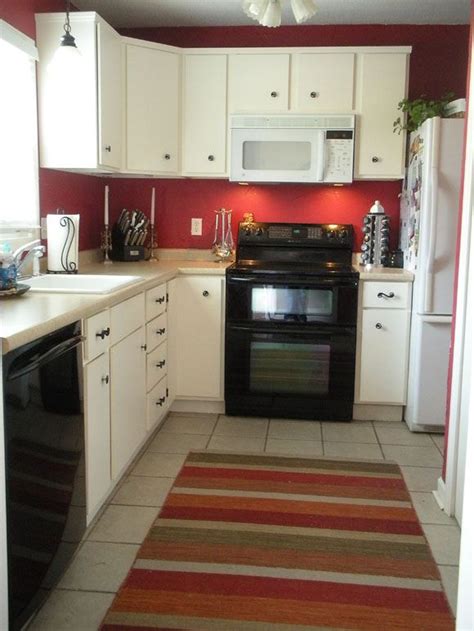 The red is tied back in to the scheme with modern red kitchen island stools. Painting my kitchen red on two opposite walls. The ...