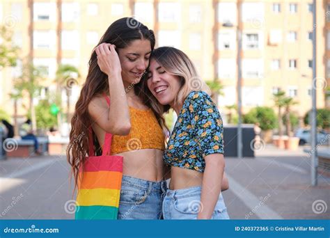 Young Lesbian Couple Hugging And Laughing Outdoors Stock Image Image