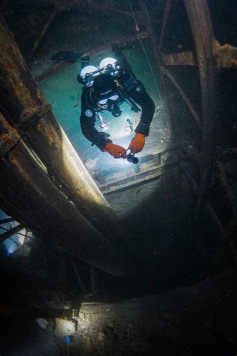A Diver Exploring A Elevator Shaft In Flooded Mine Rsubmechanophobia