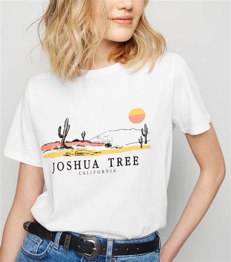 Sale proceeds directly benefit joshua tree national park, so help support joshua tree through our online park store. White Joshua Tree and Sunset Slogan T-Shirt in 2020 | T ...