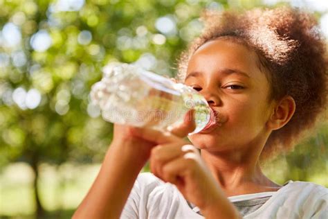 African Girl Is Drinking Mineral Water Stock Image Image Of Summer