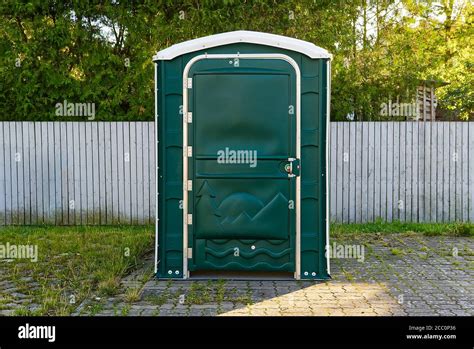 A Green Portable Plastic Toilet In A Park For Events Stock Photo Alamy
