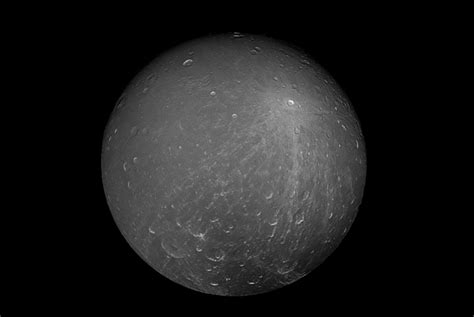 Nasa Captures Gorgeous Photo Of Saturns Ice Covered Moon Dione