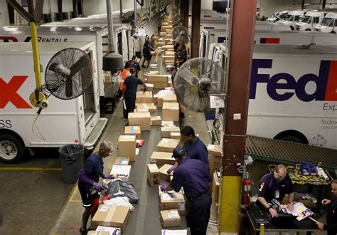 FedEx workers race to meet record demand