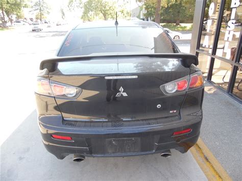 The attached carfax vehicle history report shows. 2010 MITSUBISHI LANCER RALLIART BLACK 2.0 SST TURBO AWD ...
