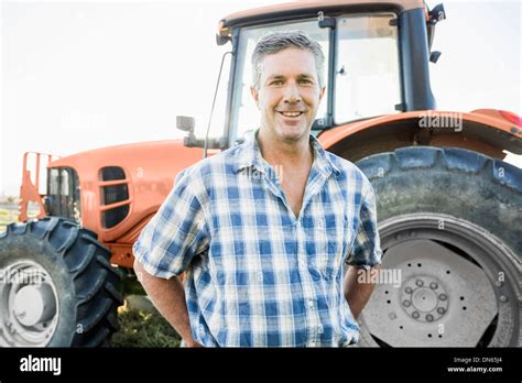 Farmer Posing With Tractor Hi Res Stock Photography And Images Alamy