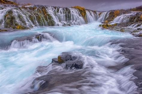 Bruarfoss Waterfall Is Located In Iceland The Blue Color Of The Water