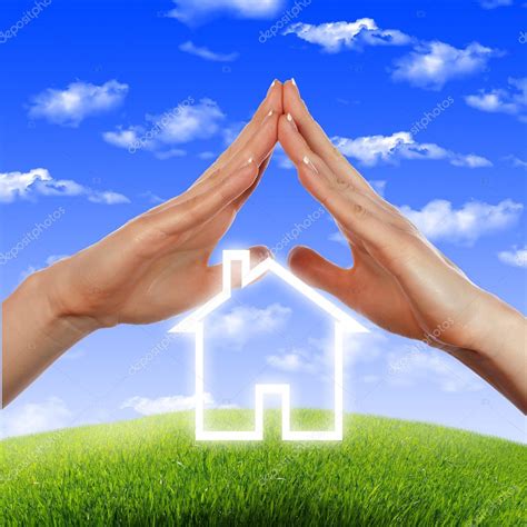 House In The Hands Against The Blue Sky — Stock Photo © Sergeynivens