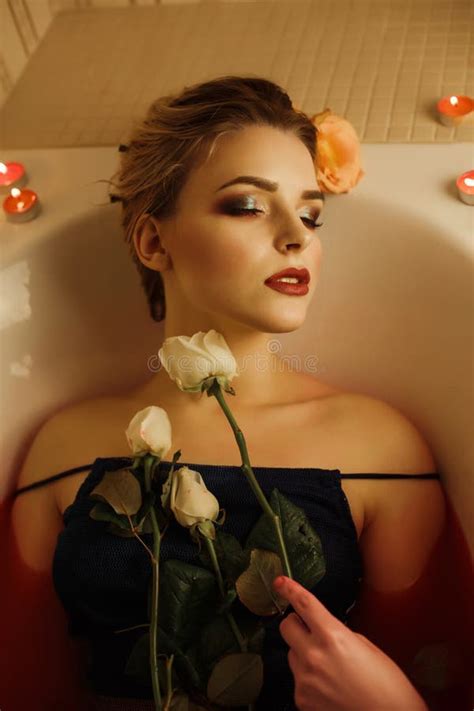 Glamorous Blonde Lady With Perfect Makeup Takes A Bath With Red Stock