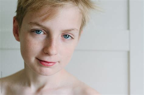 Portrait Of A Half Smiling Teenage Boy By Stocksy Contributor Helen Rushbrook Stocksy