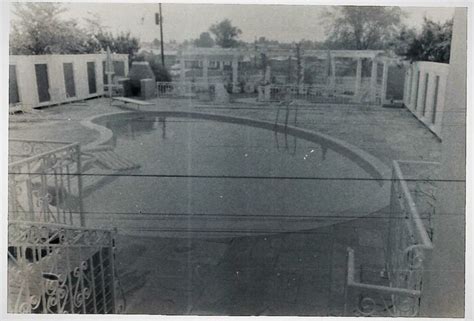 Bedford, paakron, ohcopley, ohdurham, nc. Elvis' swimming pool at Graceland. 1962. Standing on the ...