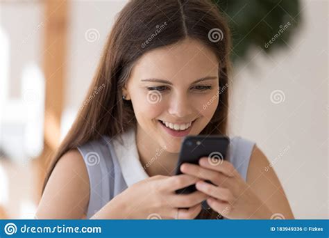 Happy Young Woman Using Wireless Internet On Smartphone Gadget Stock