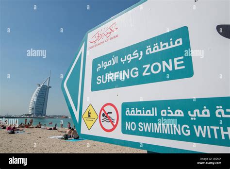 Dubai United Arab Emirates Surfing Sign On Beach In Dubai Pointing