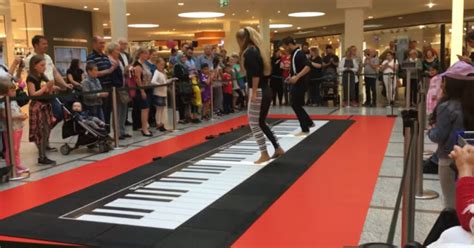 Couple Amazes Crowd When The Recreate The Iconic Floor Piano Scene From