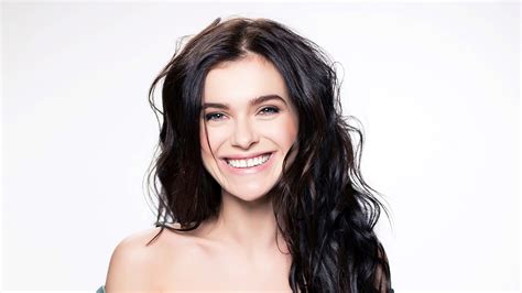 Brunette Elena Temnikova Singer With Black Hair And Cute Smile In White