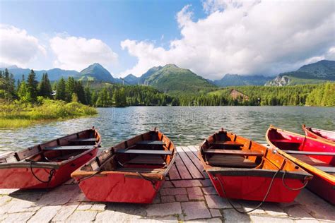 Landscape Of The Picturesque Lake Surrounded By Mountain Peaks And