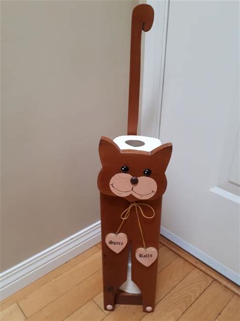 A toilet paper holder includes several parts: Nice Hand Crafted Solid Wood Spare Toilet Paper Rolls ...