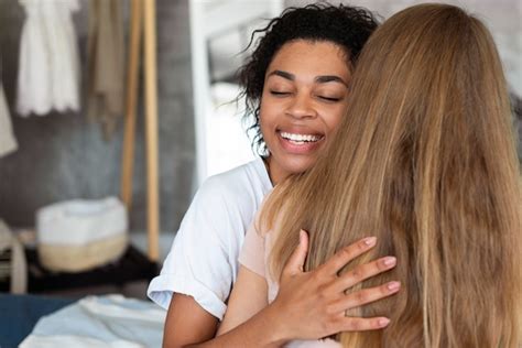 free photo two female friends hugging each other