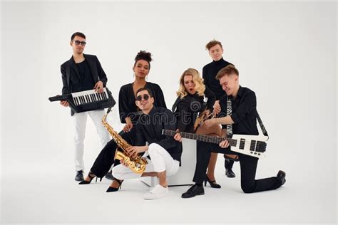 Portrait Of Diverse Group Of Young People Musical Band Playing With