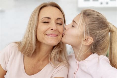 Free Adorable Daughter Kisses Her Mother On Cheek Free Photo Nohatcc