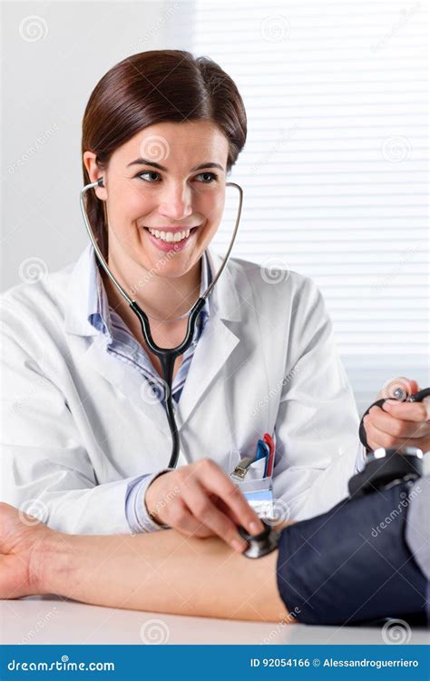 Female Doctor Checking Blood Pressure Of Patient Stock Photo Image Of