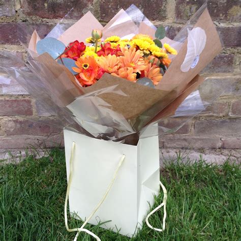 Hand Tied Aqua Packed Autumnal Bouquet Containing Freesias Variety Of